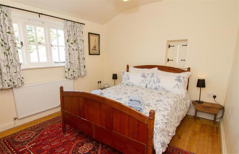 Bedroom two, double bed and wooden floorboards at Ivy Cottage (Thornham), Thornham near Hunstanton