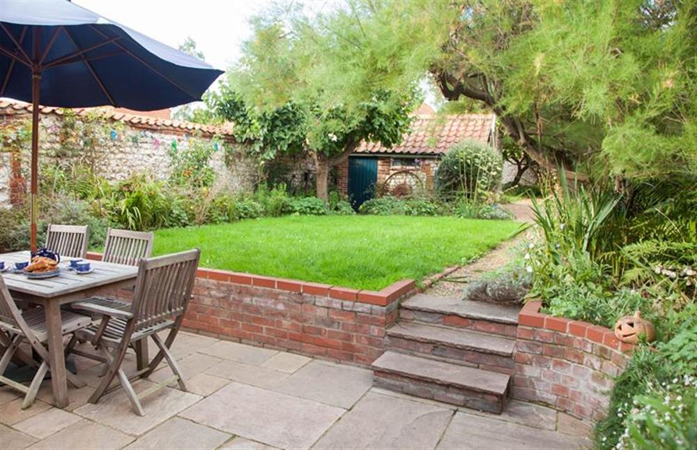 The garden has a sheltered patio area for alfresco dining at Ivy Cottage (Thornham), Thornham near Hunstanton