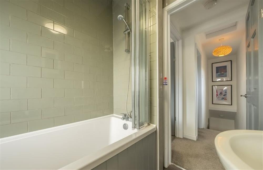 Family bathroom bath with overhead shower at Ivy Cottages, Darsham