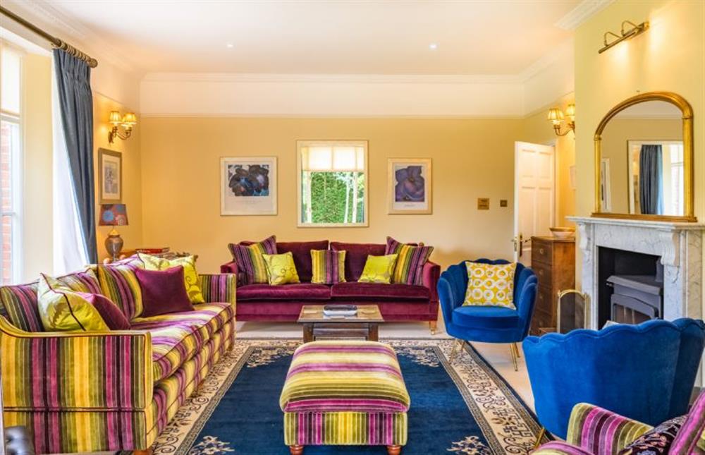 Ground floor: Colourful drawing room with wood burning stove