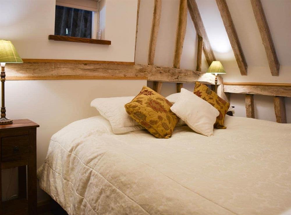 Welcoming bedroom with double bed at Ivy Todd Barn in Ashdon, near Saffron Walden, Essex