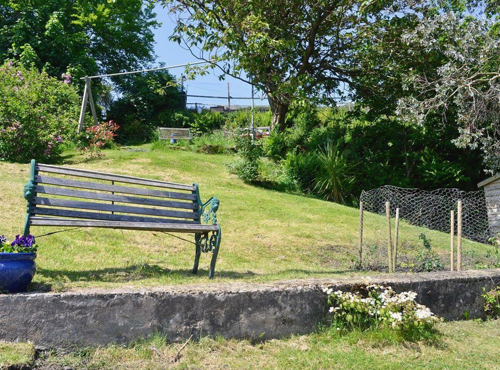 Garden with small courtyard and garden furniture at Ivybank Cottage in Lamlash, Isle of Arran, Isle Of Arran