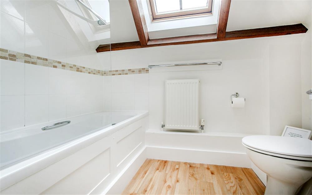 Bathroom with shower over bath at Ixworth Cottage in Ottery St Mary
