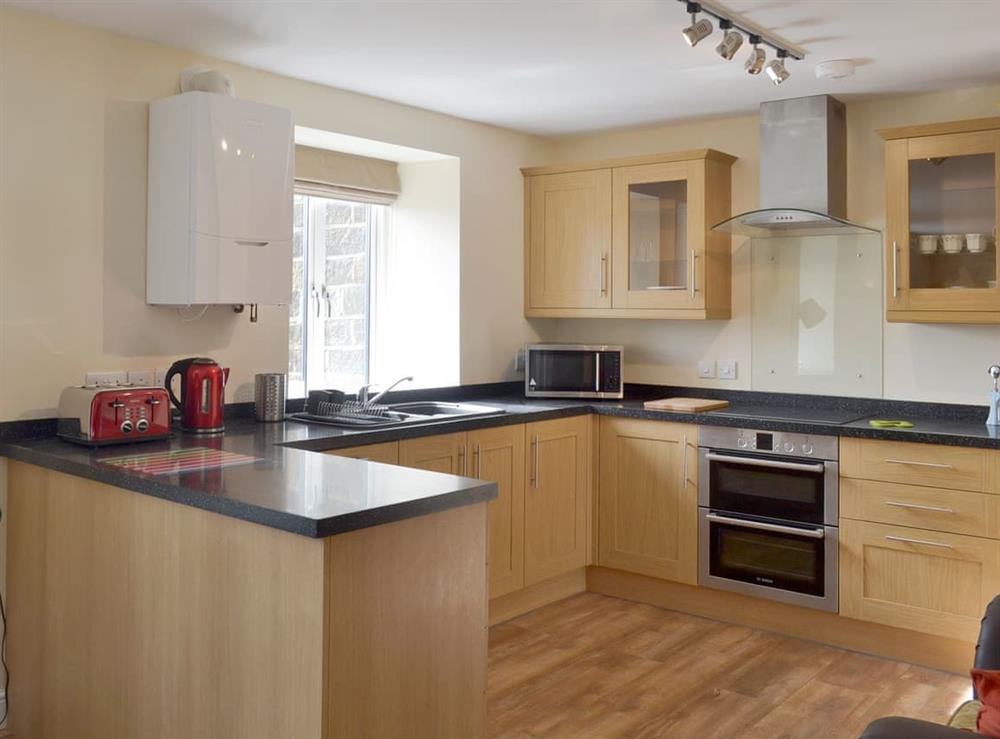 Spacious well-equipped fitted kitchen at Swallow View, 