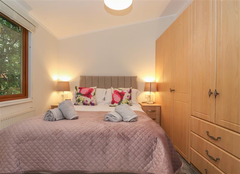 This is a bedroom at JacMar Lodge, Windermere