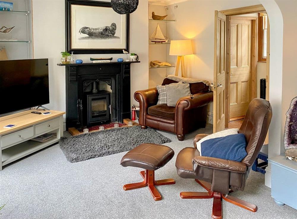 Living room with wood burner at Jacobs Rest in Cromer, Norfolk