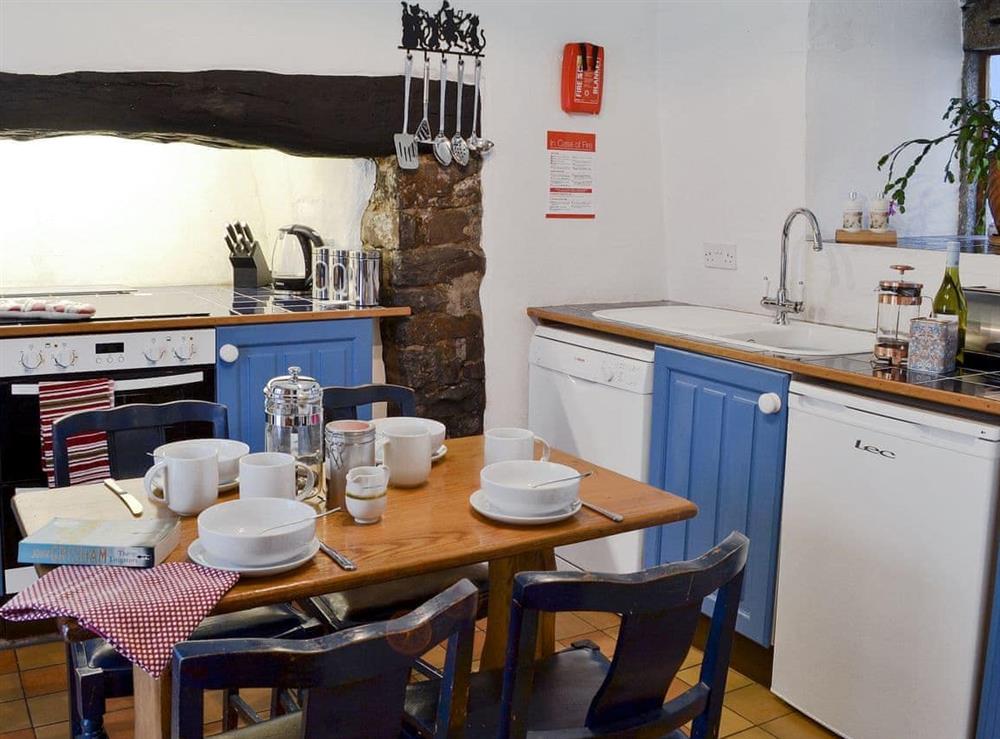 Kitchen with dining table (photo 2) at Jalna in Stratton, near Bude, Cornwall