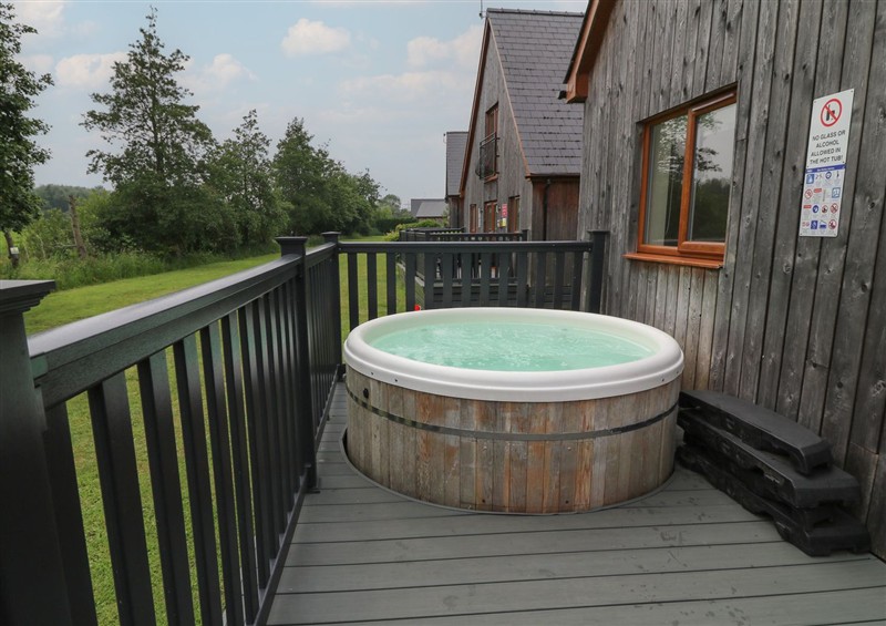 Relax in the hot tub at James Ville Marina Lodge 14, Brigg