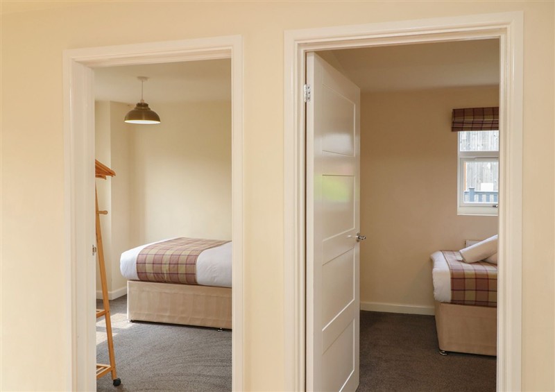This is a bedroom at James Ville Marina Lodge 8, Brigg