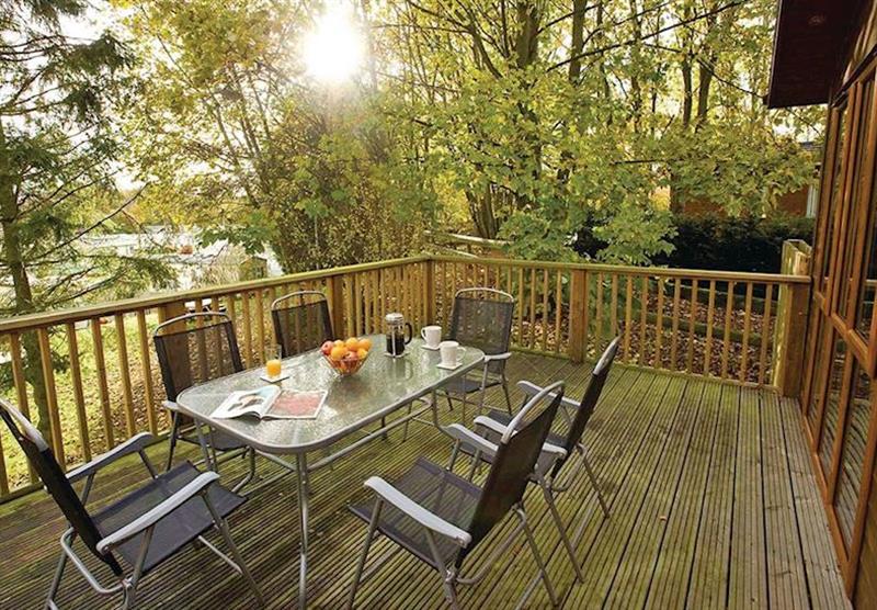 Seating on the decked area at the Sandstone Lodge at Jamies Cragg Holiday Park in Welburn, Vale of York
