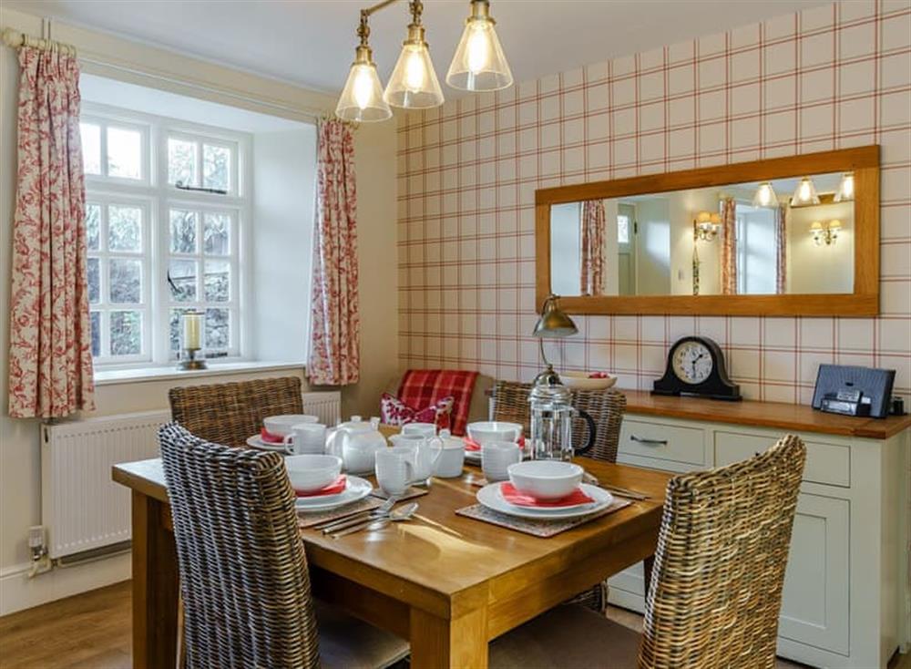 Dining area at Jasmine Cottage in Bourton-on-the-Water, Gloucestershire