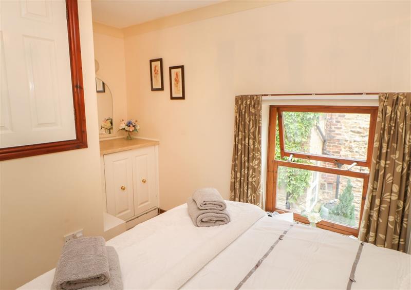 A bedroom in Jasmine Cottage at Jasmine Cottage, Richmond
