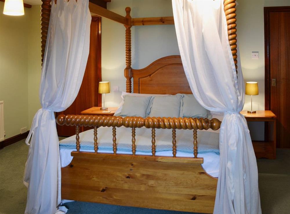 Four Poster bedroom (photo 2) at Jasmine Cottage in Scarborough, North Yorkshire
