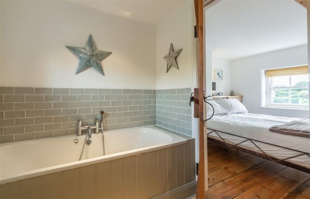 First floor: Master bedroom and family bathroom at Jasmine Cottage, South Creake near Fakenham