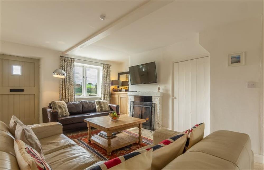Ground floor: Comfortable sitting room has open fire at Jasmine Cottage, South Creake near Fakenham