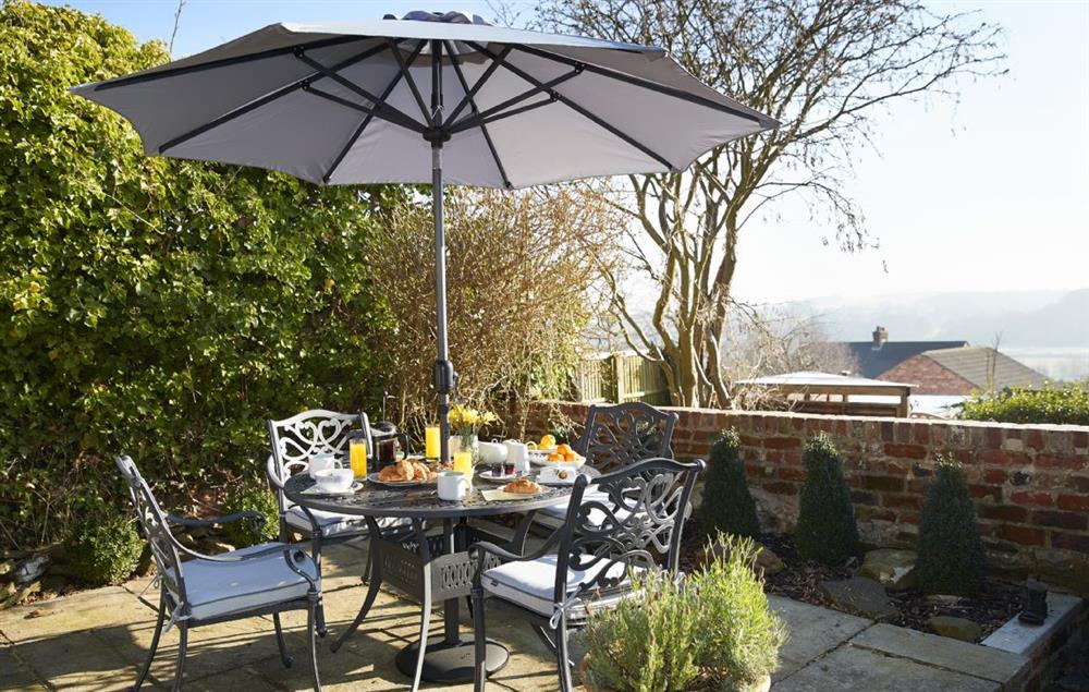 Garden table seating four guests and with spectacular views at Jasmine Cottage, South Wingfield near Crich