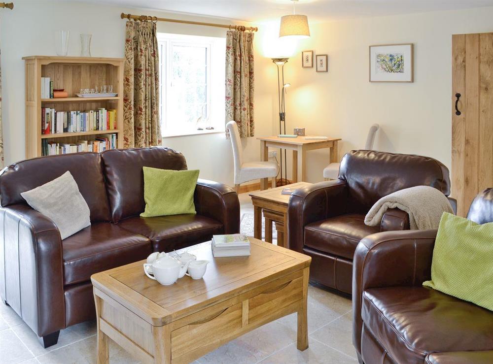 Attractive living room with small study area at Herons Weir, 