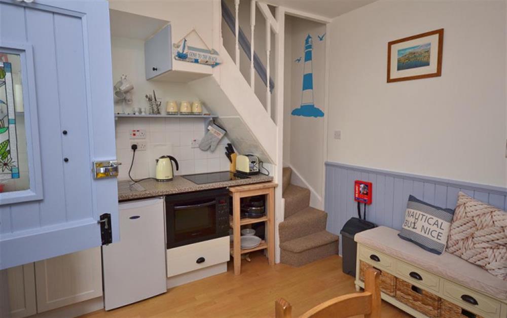 Kitchen dining room and stairs to first floor. at Jemima Cottage in Looe