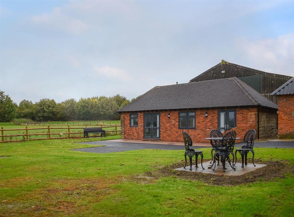 Lovely lodge with dedicated patio area with seating at Jemmett Lodge in Mersham, near Ashford, Kent