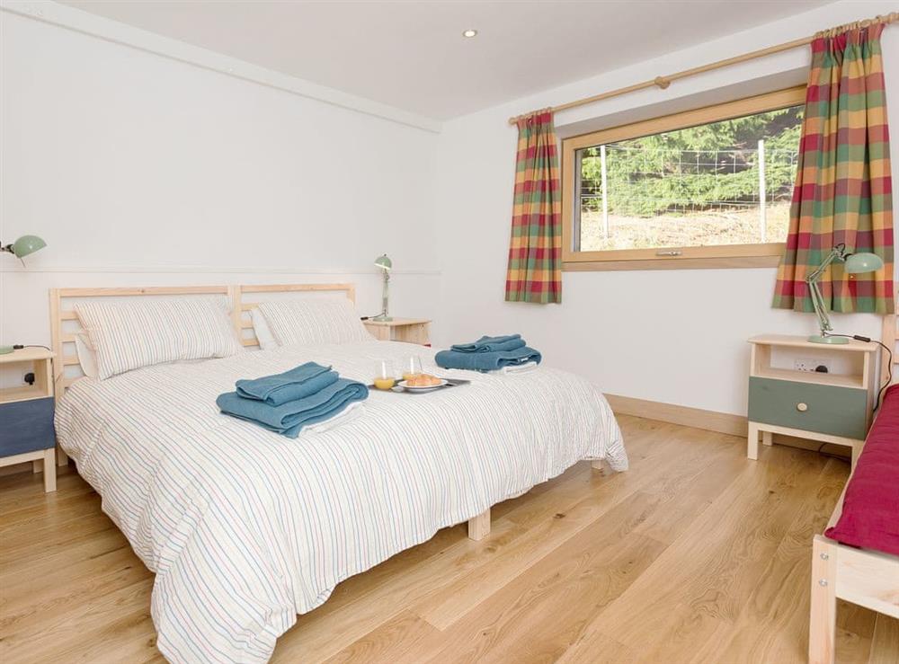 Peaceful bedroom with link beds that can be set as twin or double at Jill Strawbale House in Strontian, near Fort William, Highlands, Argyll