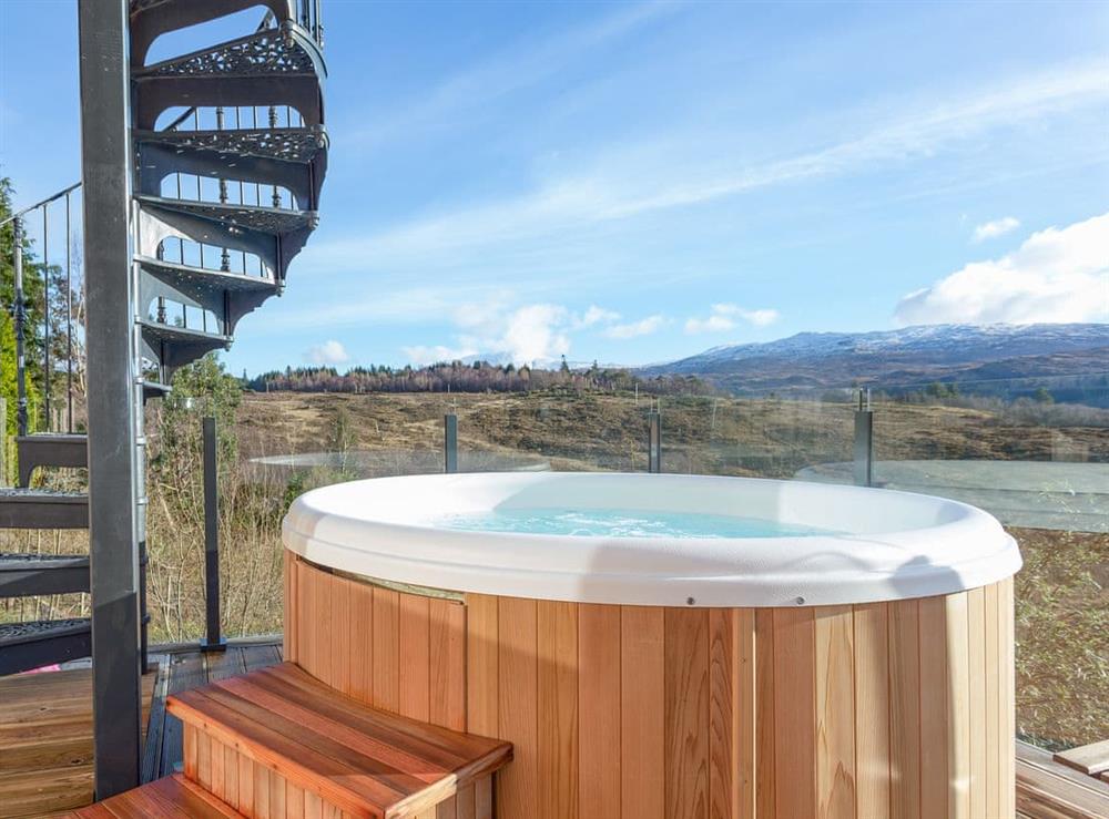 Relaxing private hot tub with countryside views at Jill Strawbale House in Strontian, near Fort William, Highlands, Argyll