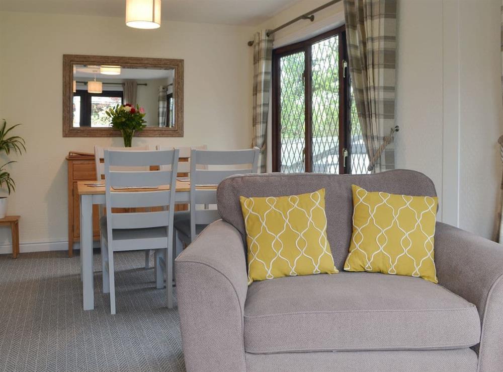 Living room/dining room at Josnor Chalet in Benllech, Anglesey, Gwynedd