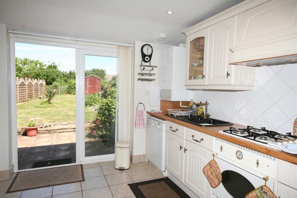 Kitchen leading to patio and garden at Joymead Cottage in Malborough, Nr Kingsbridge