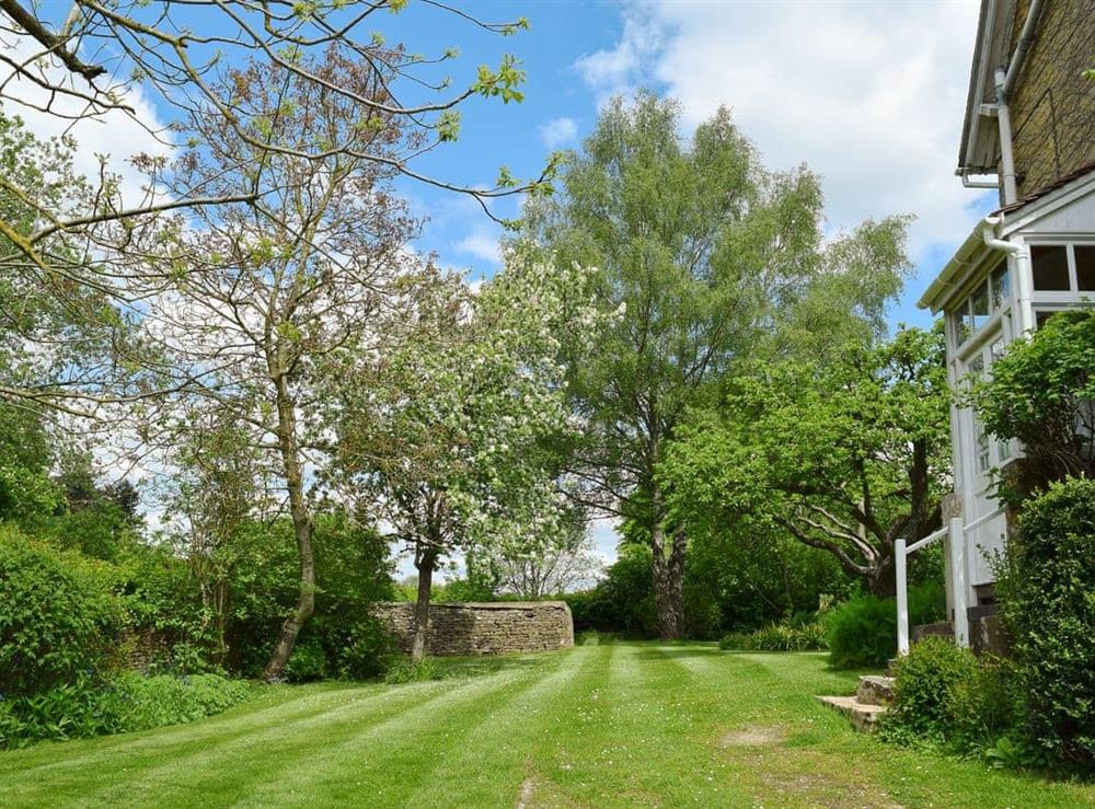 Large lawned garden at Jubilee Cottage in Church Enstone, near Chipping Norton, Oxfordshire