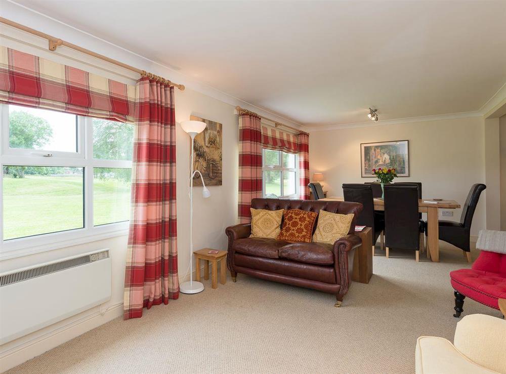 Living room with additional dining area at Jubilee Lodge in Watton, Norfolk