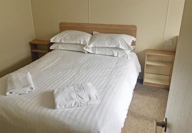 Double bedroom in a Bodmin 2 at Juliots Well Holiday Park in Camelford, North Cornwall