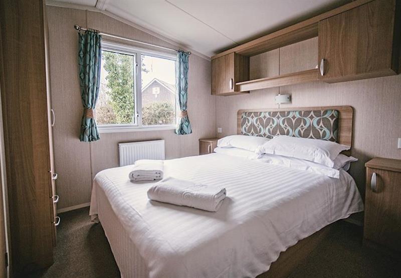 Double bedroom in a Tintagel 3 at Juliots Well Holiday Park in Camelford, North Cornwall