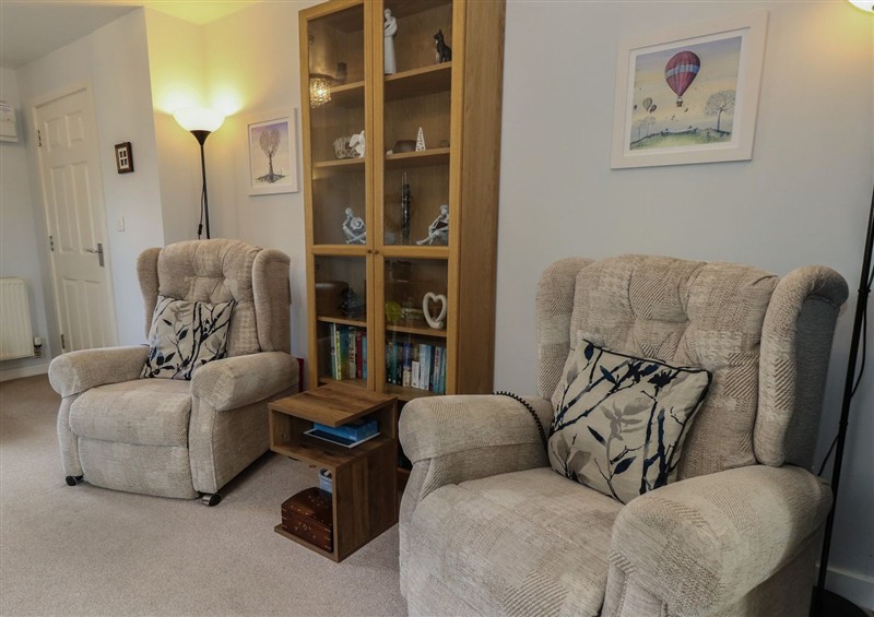 Relax in the living area at June Cottage, Wool