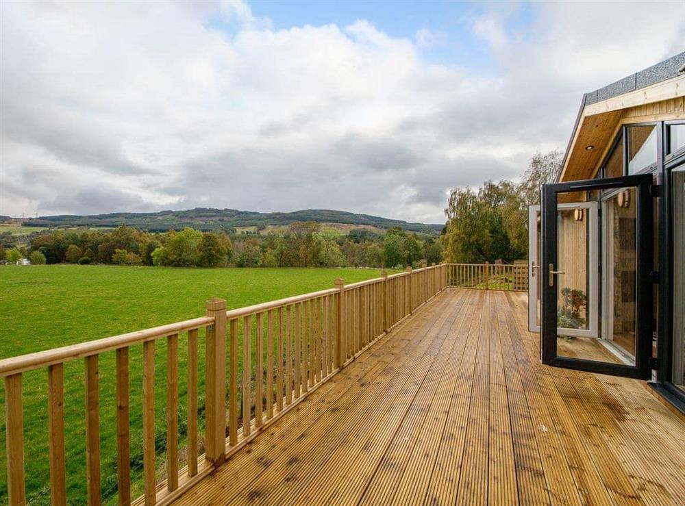 Outstanding holiday home with large decked terrace at Karelia Lodge in Keltyneyburn, near Aberfeldy, Perthshire