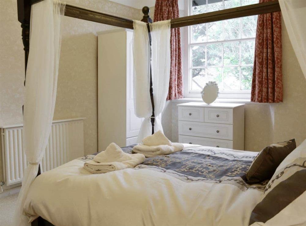 Peaceful four poster bedroom at Karslake House in Winsford, near Dulverton, Somerset