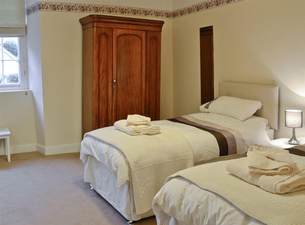 Twin bedroom at Karslake House in Winsford, near Dulverton, Somerset