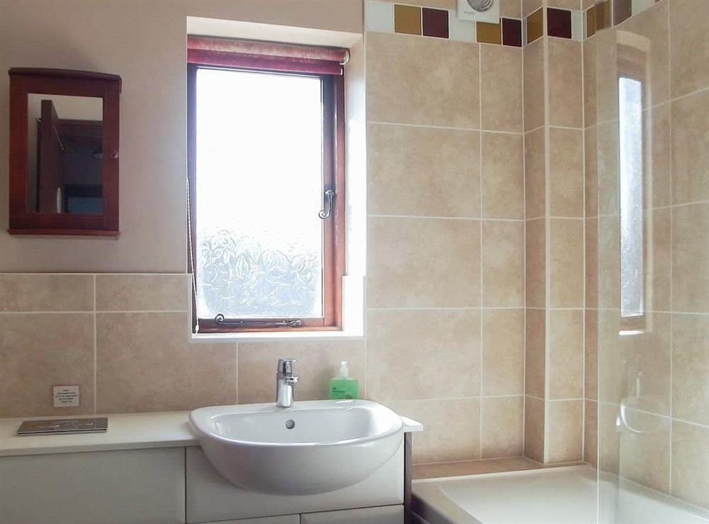 Lovely bathroom with shower over the bath at Kays Cottage in Buckfastleigh, Devon