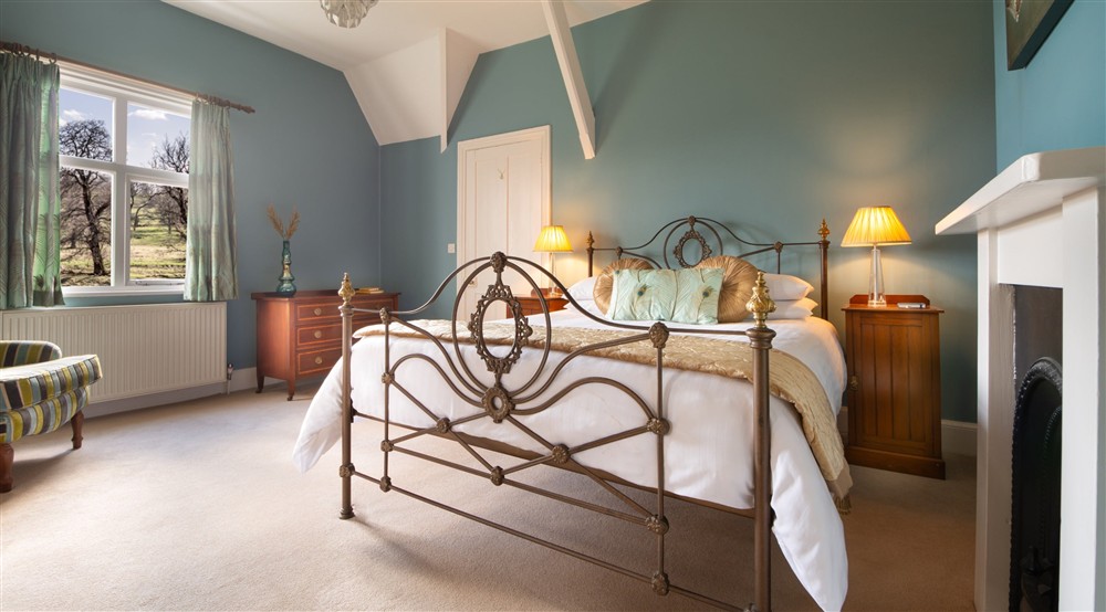 The double bedroom with en-suite shower room at Kedleston Park House in Derby, Derbyshire