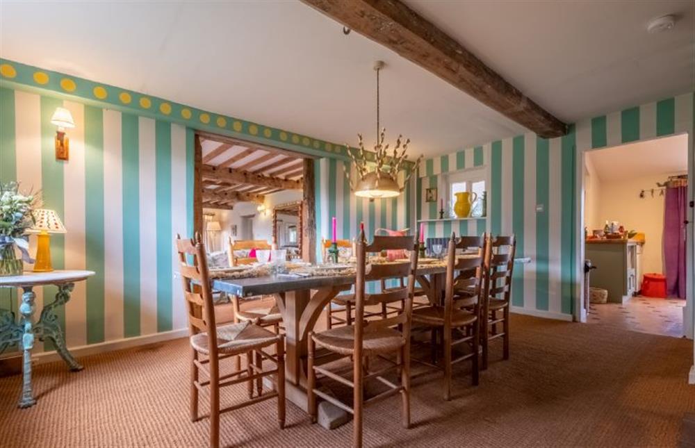 The dining room with table seating up to eight guests at Keepers Cottage, Aylsham