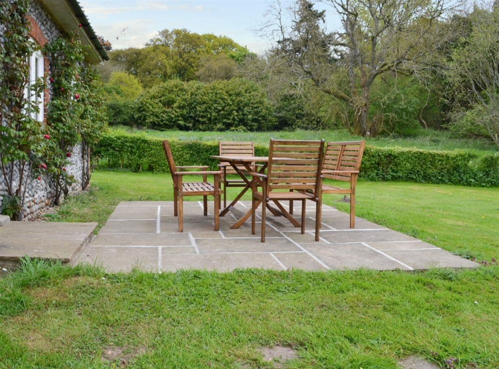 Wonderful patio with wooden garden furniture at Keepers Cottage in East Beckham, near Sheringham, Norfolk