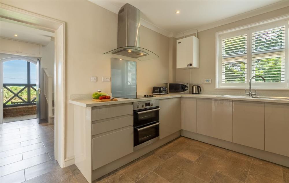 Spacious kitchen with an electric oven and hob at Keepers Cottage, Middleton