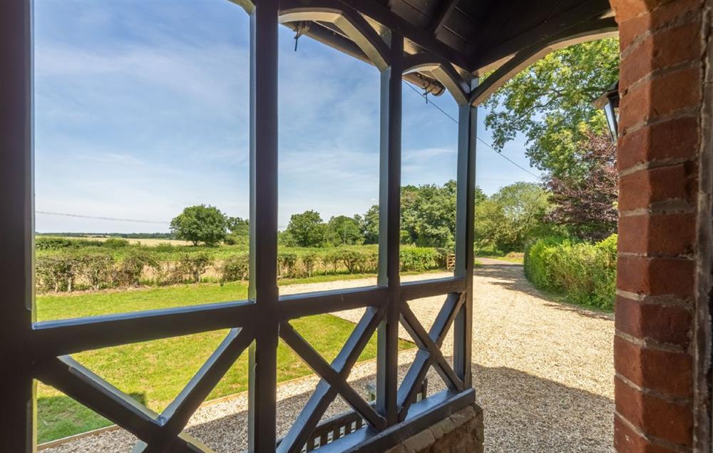 The welcoming porch area overlooking the gardens at Keepers Cottage, Middleton