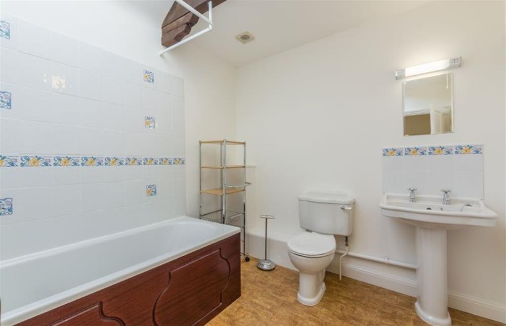 First floor: Family bathroom has shower over bath at Keepers Cottage, West Barsham near Fakenham