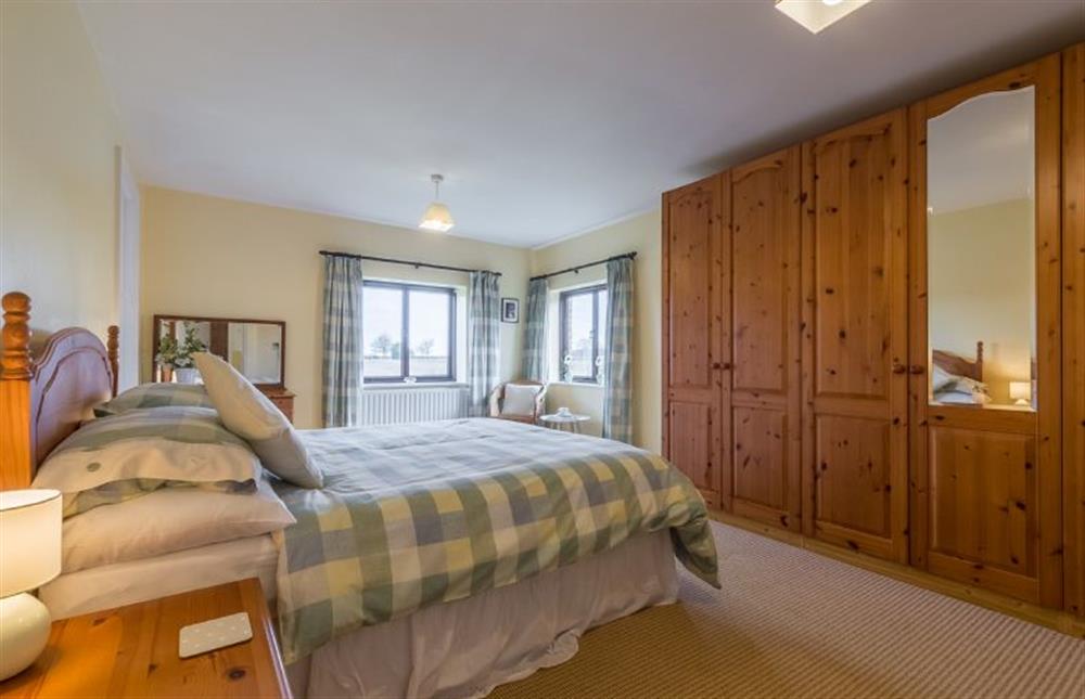 First floor: The duel aspect master bedroom at Keepers Cottage, West Barsham near Fakenham