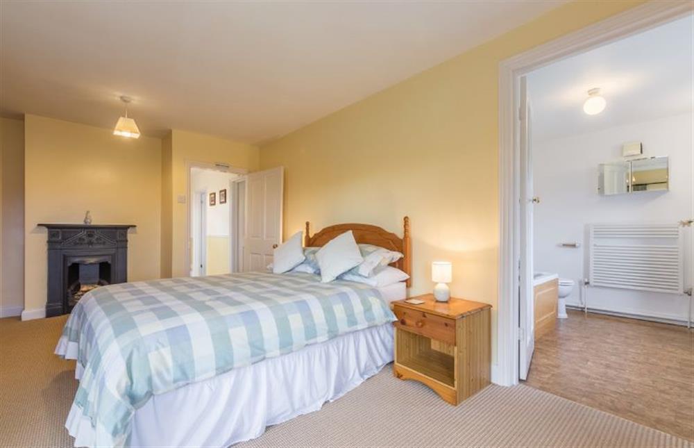 First floor: The master bedroom has en-suite bathroom at Keepers Cottage, West Barsham near Fakenham