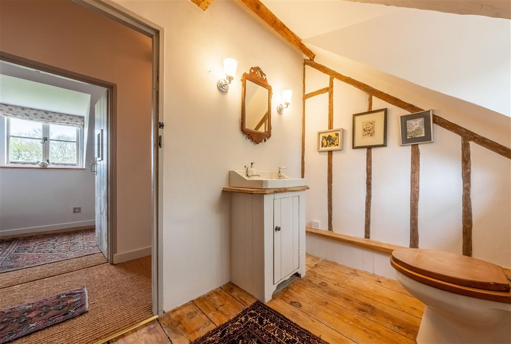 Second family bathroom with bath, wash basin and WC at Keepers Cottage, Wolterton