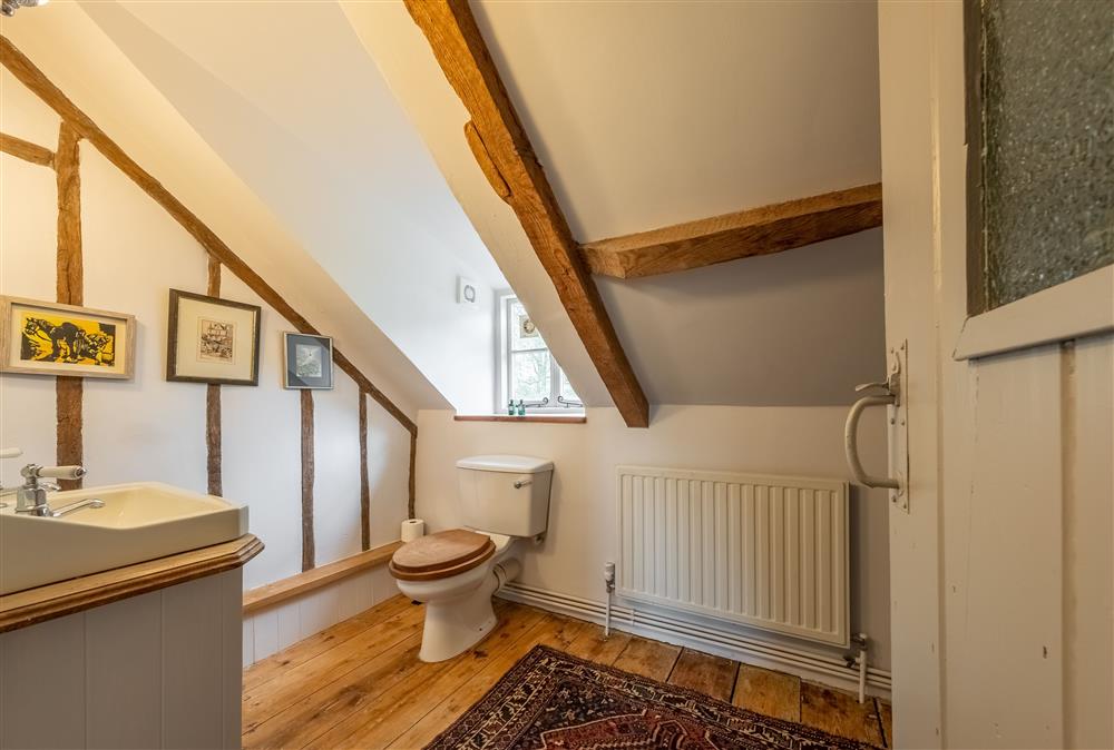 Second family bathroom with exposed beams at Keepers Cottage, Wolterton