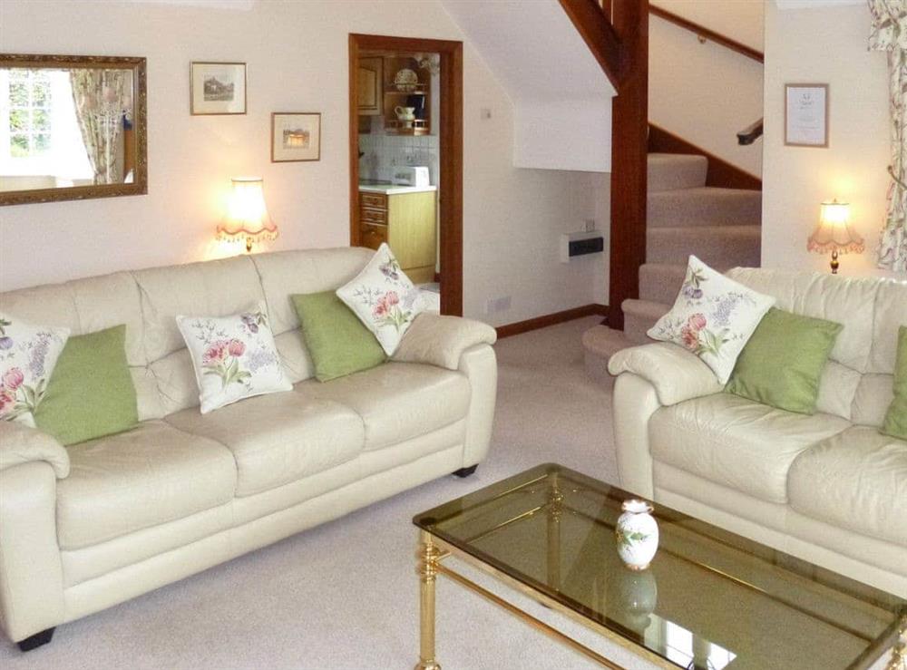Comfy seating within living room at Keith Cottage in Sway, near Lymington, Hampshire