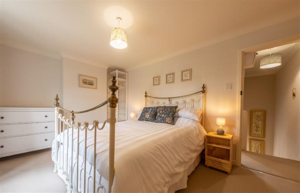 The master bedroom has a comfortable king-size bed at Ken Hill Cottage, Snettisham near Kings Lynn