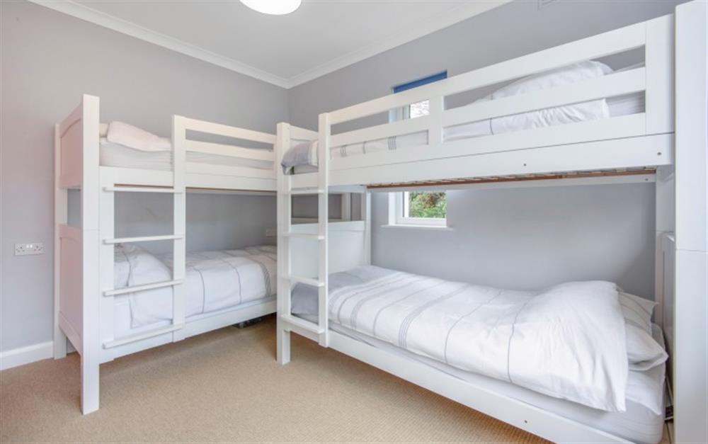 The ground floor bedroom with 2 sets of 3ft bunk beds. at Kersbrook in Stoke Gabriel