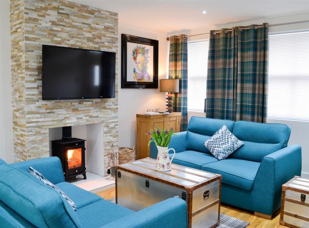 Luxurious living area with wood burner at Key to the Esk in Longtown, near Carlisle, Cumbria